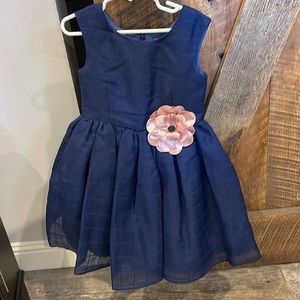 Navy blue dress with flower appliqué